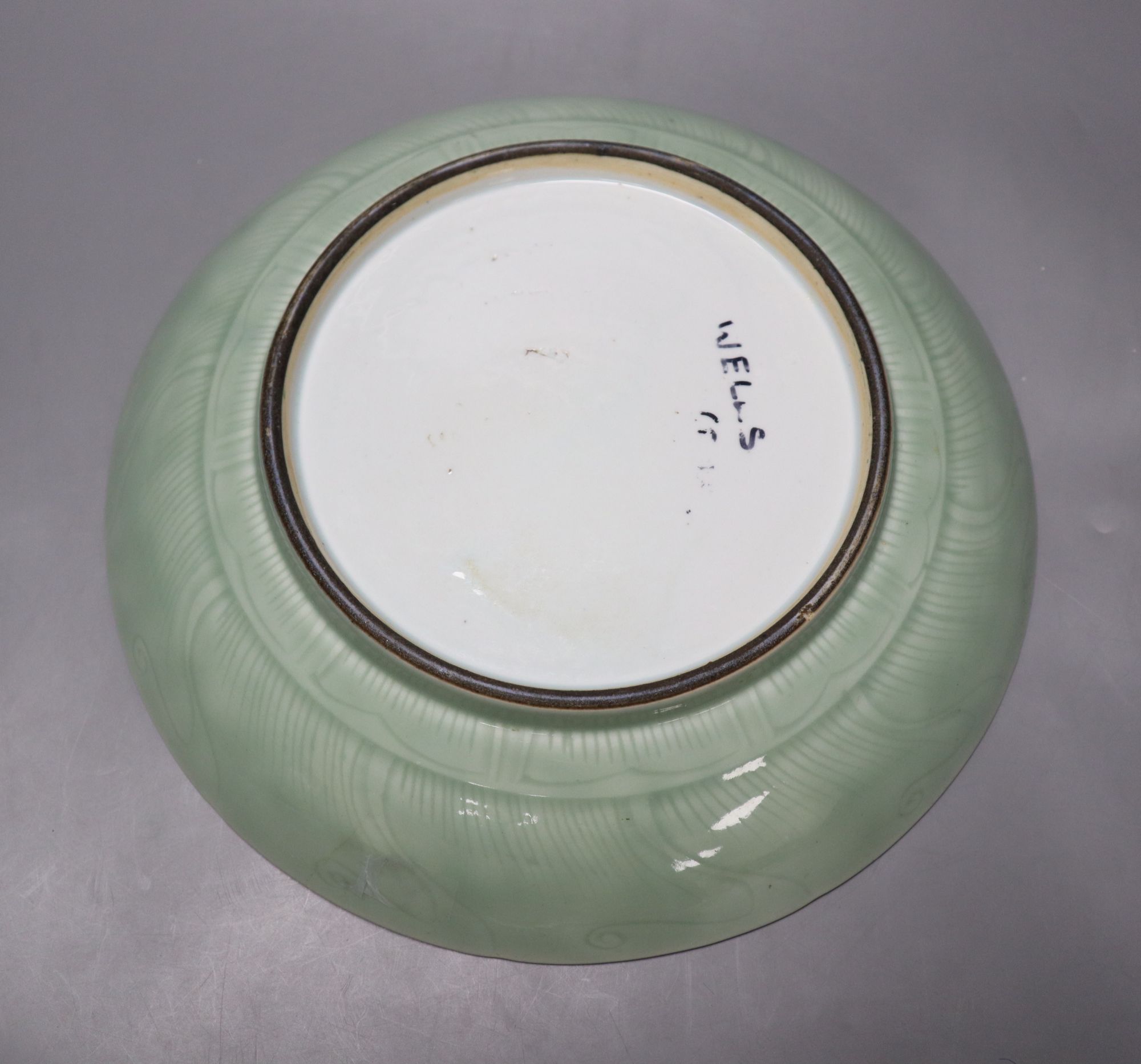 A 19th century Chinese celadon lotus dish, diameter 33cm (faults)